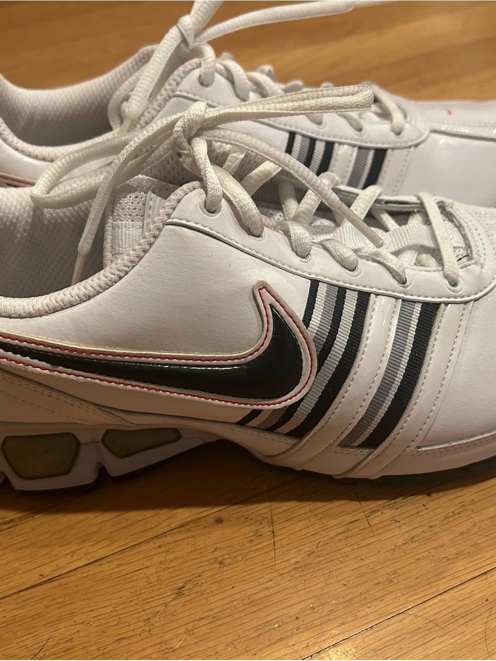 Nike White Shoes with Black Swoosh and Stripe Accents